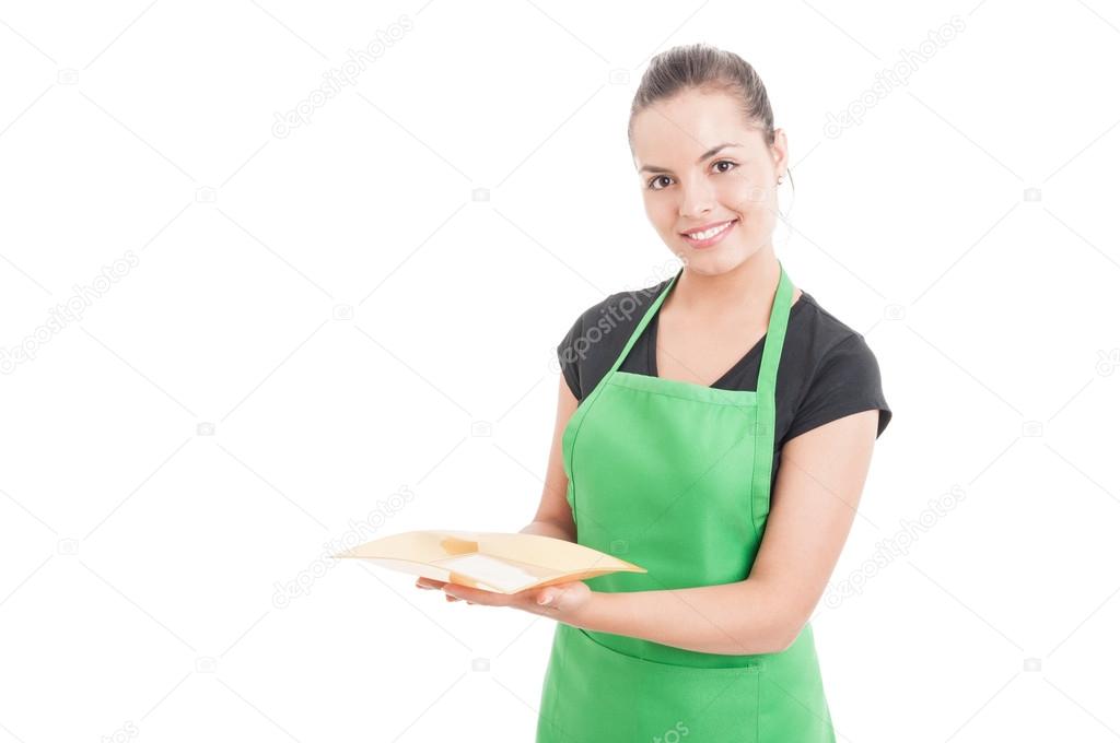 Friendly young saleswoman woman holding empty plate 
