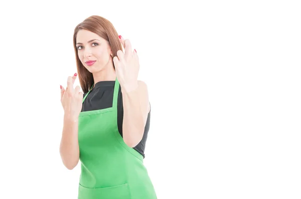 Young female employee holds her fingers crossed — Stock Photo, Image