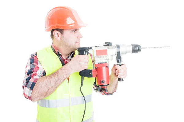 Workman with helmet holding the drilling machine — Stock Photo, Image