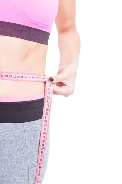 Vista lateral de la cintura de la mujer en forma con línea de cinta — Foto de Stock