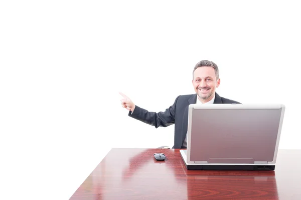 Cheerful businessman poiting on copyspace Stock Photo