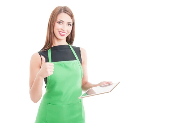 Happy female seller with tablet showing thumbup — Stock Photo, Image