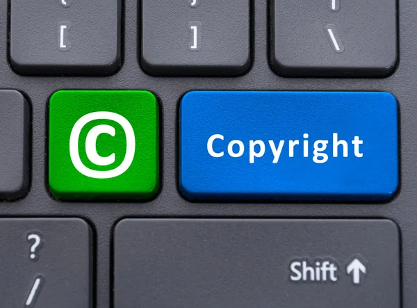 Botón de texto y símbolo de copyright en el concepto de teclado — Foto de Stock