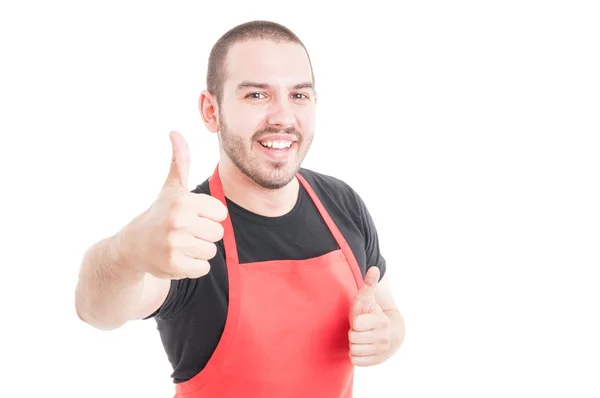 Alegre empleado de supermercado mostrando doble como signo — Foto de Stock