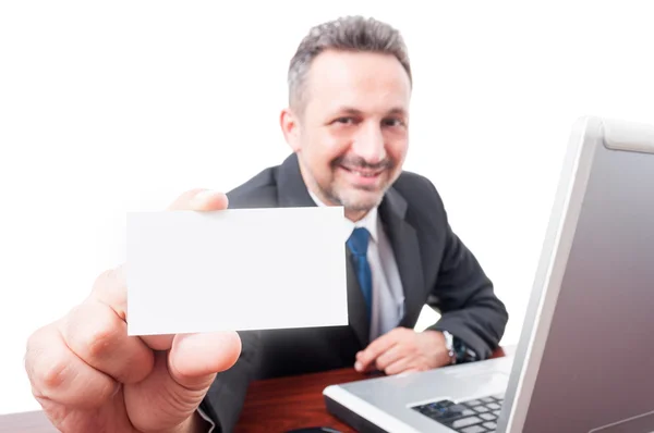 Handsome manager showing visit card — Stock Photo, Image