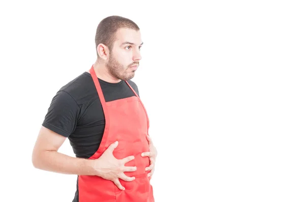 Pracownik supermarketu nadęty z ból brzucha — Zdjęcie stockowe