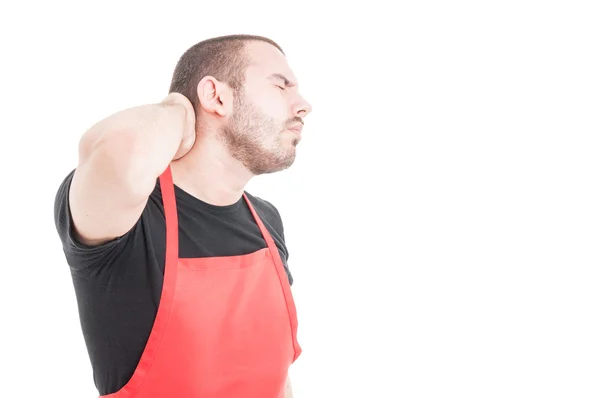 Young supermarket seller having neck pain — Stock Photo, Image