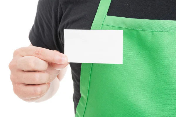 Close-up of supermarket employee showing business card — Stock Photo, Image