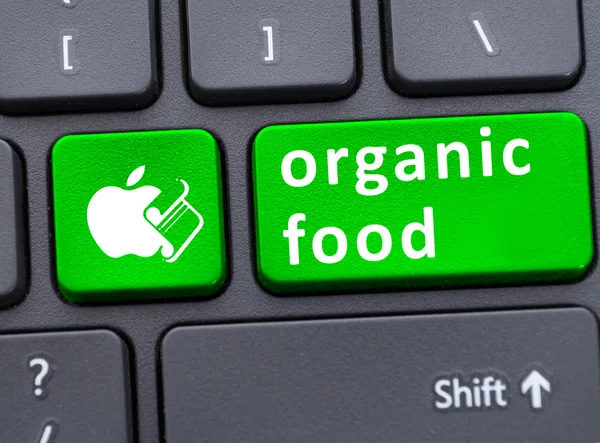 Alimentos orgánicos en el botón del teclado — Foto de Stock