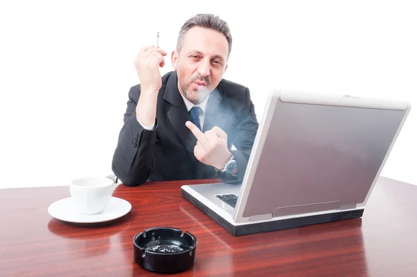 Man at office showing fuck you and smoking — Stock Photo, Image