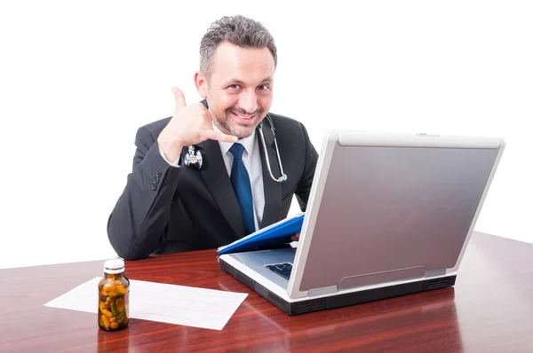 Medic at office showing call me gesture — Stock Photo, Image