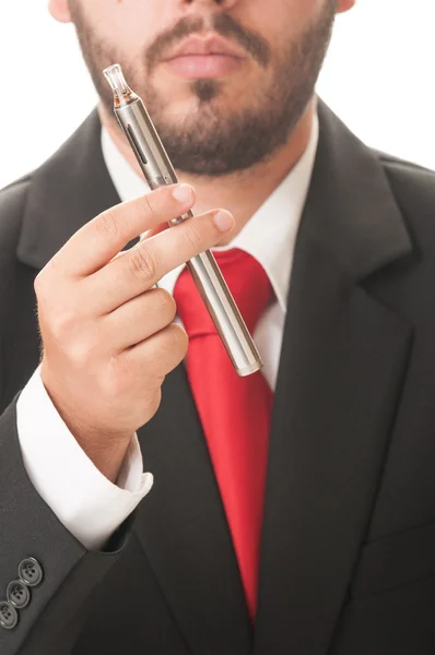 Obchodní muž držící elektronická cigareta — Stock fotografie
