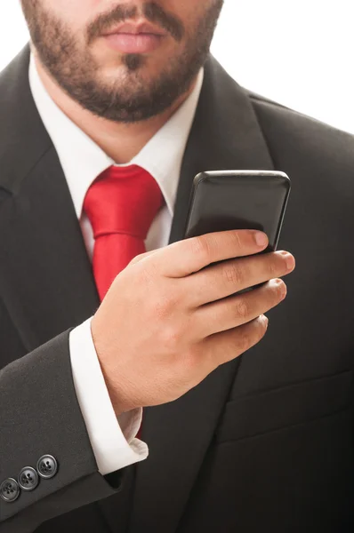 Homem de negócios verificando seu smartphone — Fotografia de Stock