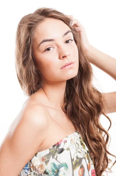 Beautiful woman touching her long hair — Stock Photo, Image