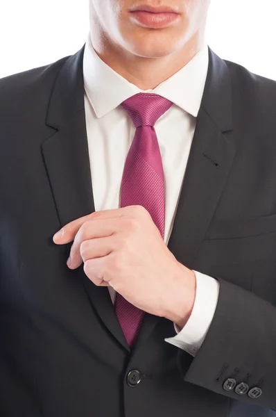 Fashionable business male model fixing his suit jacket — Stock Photo, Image