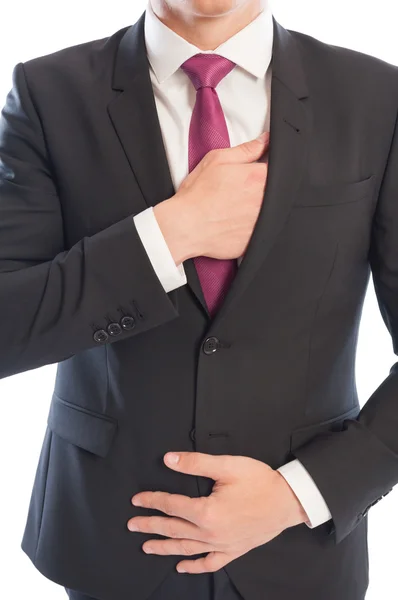 Modelo masculino caucasiano elegante atingindo seu bolso interior terno — Fotografia de Stock