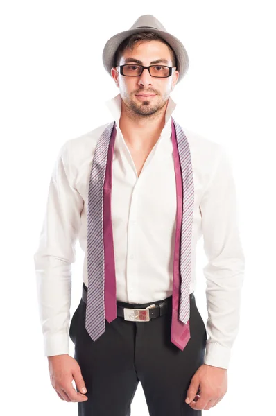 Two neckties hanging on male model wearing glasses and hat — Stock Photo, Image