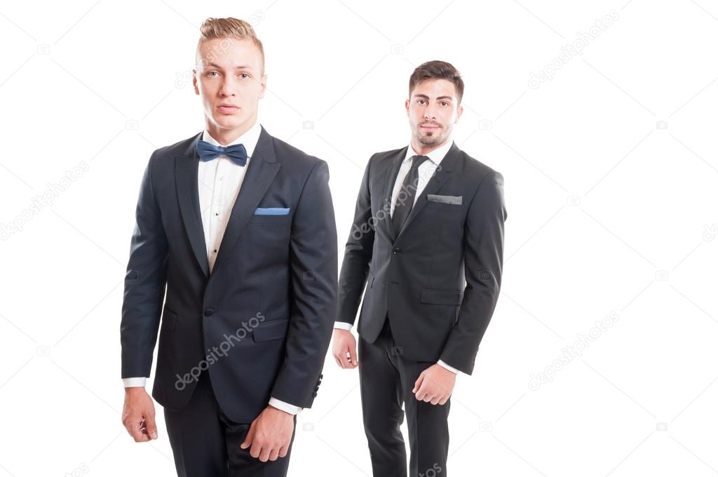 Elegant men wearing suits, necktie and bowtie