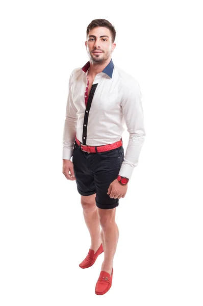 Brunet model wearing black short pants, white shirt and red belts — Stock Photo, Image