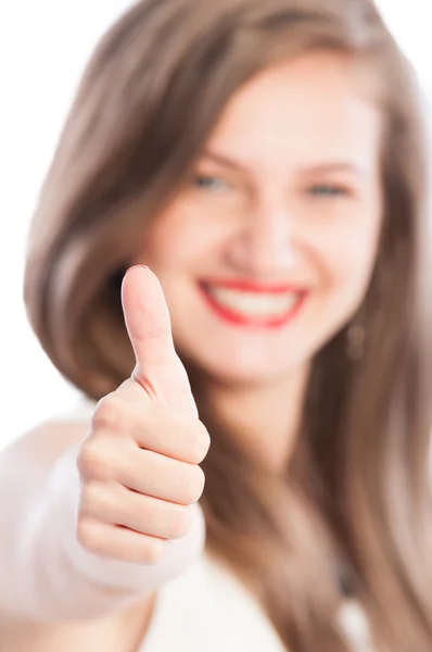 Business woman showing thumbs-up with focus on hand — Stock Photo, Image