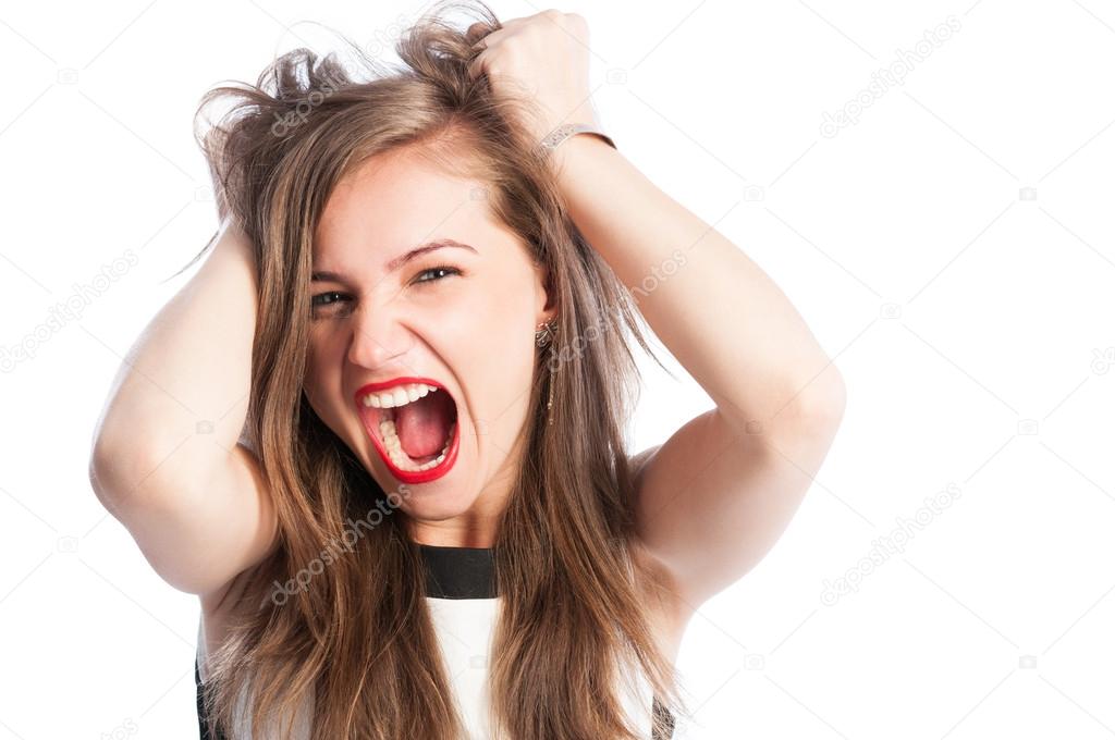 Woman screaming and grabbing her hair