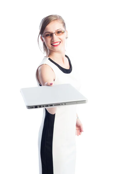 Smiling business woman handing a laptop — Stock Photo, Image
