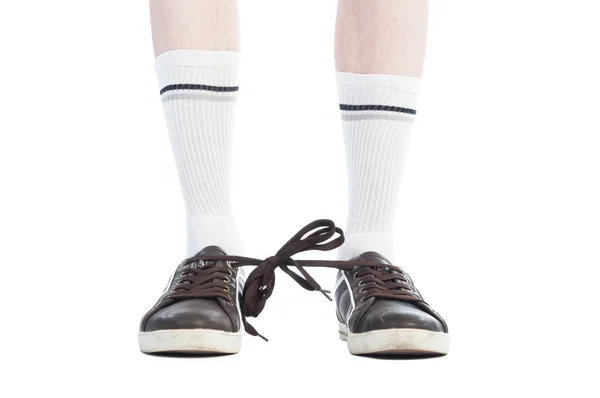 Long socks and shoe laces tied together prank — Stock Photo, Image