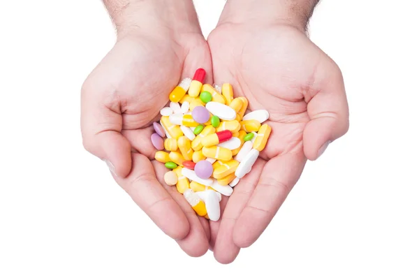 Two hands holding pills — Stock Photo, Image