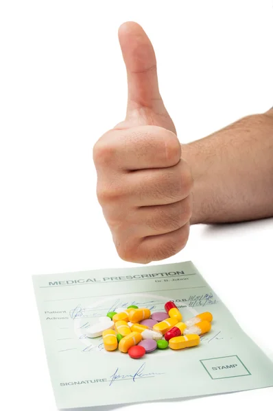 Hand showing thumbs up above a medical prescription — Stock Photo, Image