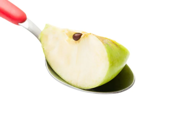 Apple slice on a spoon — Stock Photo, Image