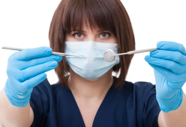 Dentist woman holding tools — Stock Photo, Image