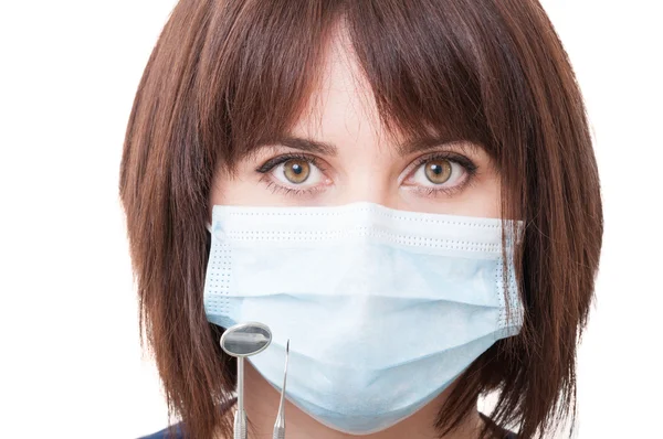 Primer plano con una cara de mujer dentista — Foto de Stock