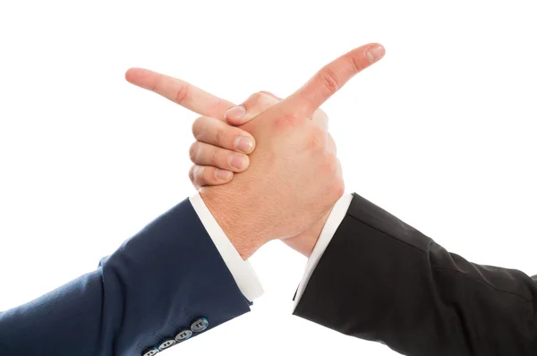 Business men shaking hands and pointing at each other — Stock Photo, Image