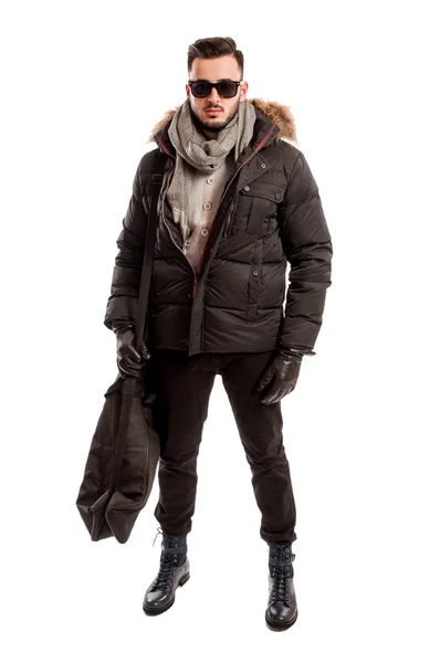 Fashionable male model wearing winter clothes and a big bag — Stock Photo, Image