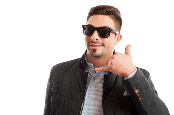 Handsome and funky sales man making call me gesture — Stock Photo, Image