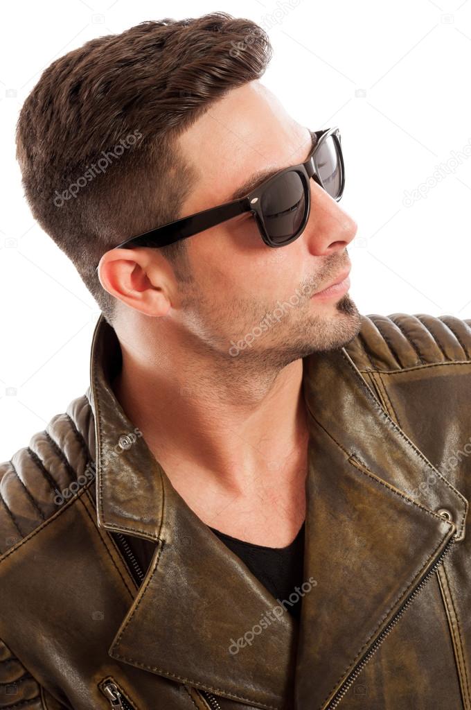Handsome man wearing leather jacket and sunglasses