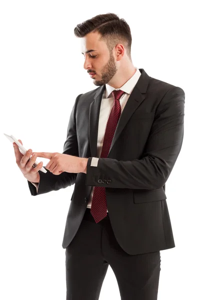 Affärsman kontrollera försäljning på en Tablet PC — Stockfoto