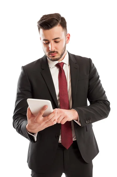 Suited business man using a tablet — Stock Photo, Image