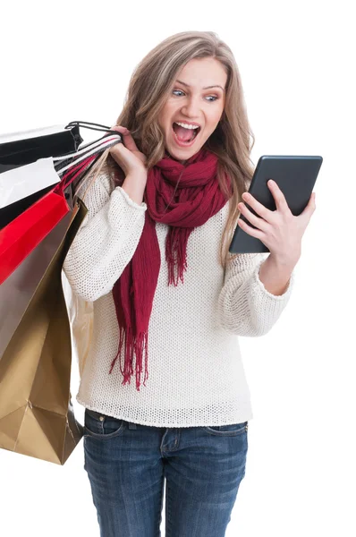 Shopping girl checking her tablet — Stock Photo, Image