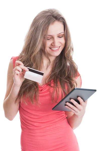 Cute shopping girl using a credit card — Stock Photo, Image