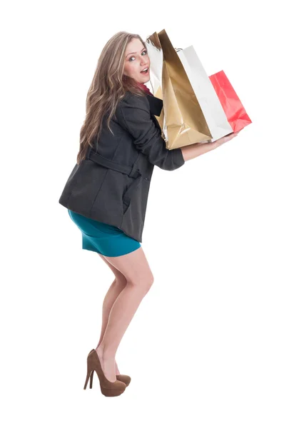 Compras chica sosteniendo bolsas pesadas —  Fotos de Stock