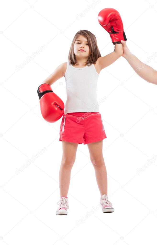 Young boxer girl is a winner