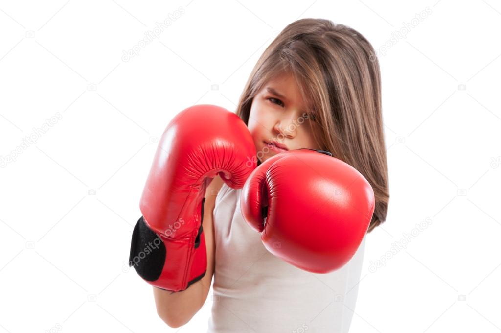 Young boxer girl in a fighting position