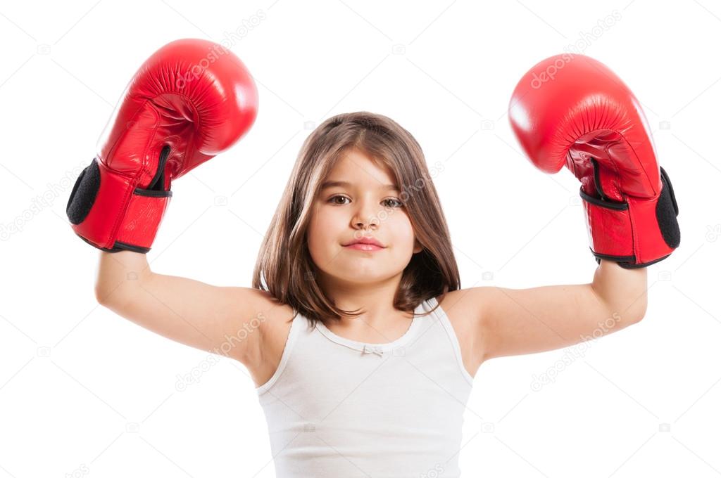Young boxer girl raising arms up