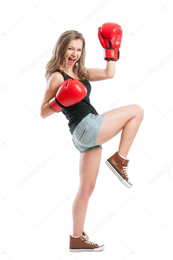 Beautiful female model with boxing gloves screaming