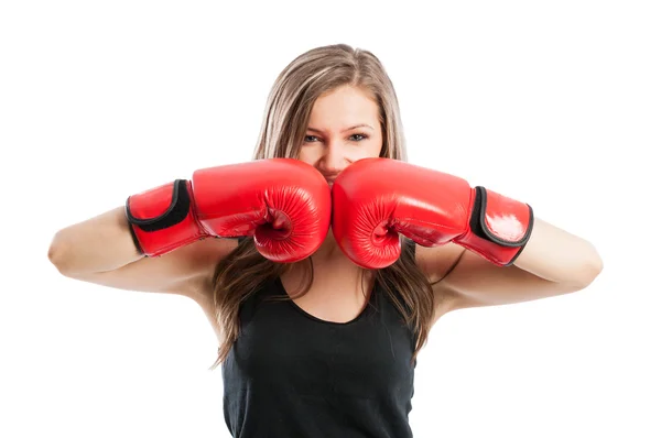 Female boxer touching red boxing gloves — Stock Photo, Image