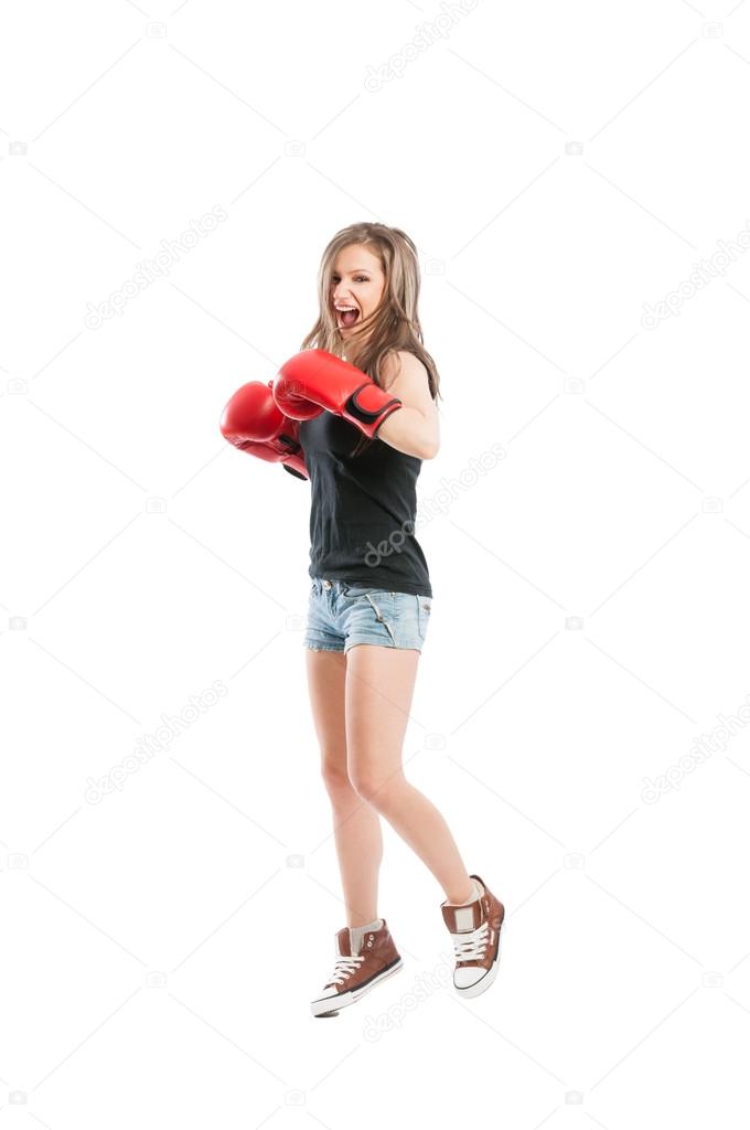 Female fighter jumping and laughing