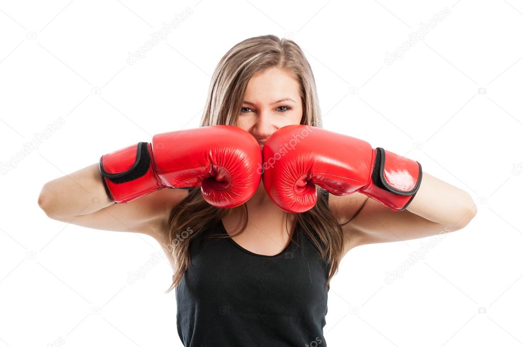 Female boxer touching red boxing gloves