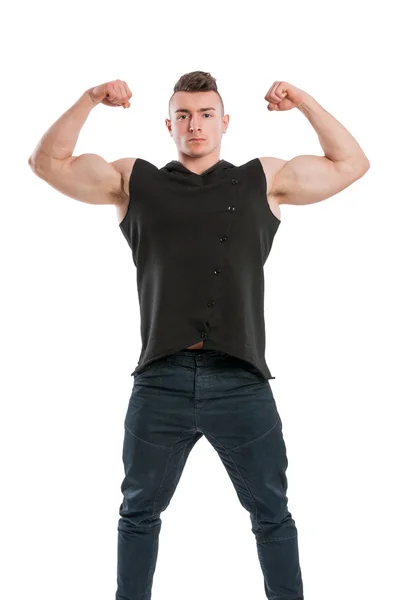 Fiatal férfi modell pontosan feltünteti a nagy izmos karok — Stock Fotó