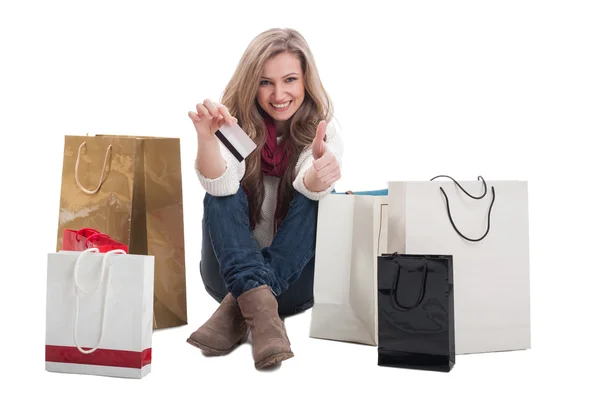 Woman holding credit card and showing thumbs u — Stock Photo, Image